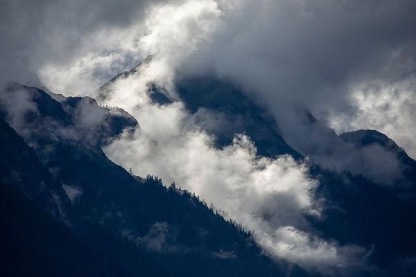 Alaska-Tracy Arm-Fords Terror Wilderness-Morning sun lights mist swirling in mountains